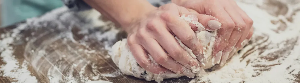 Hands that are kneading dough