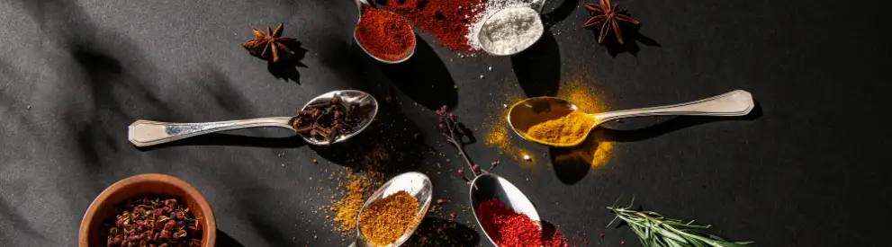 Spice up your food in a correct way Different spices laying on a table